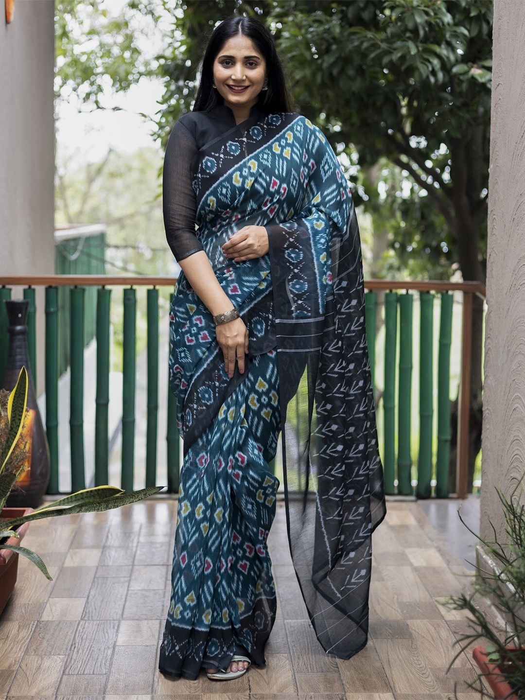 

Mitera Teal & White Ethnic Motifs Pure Cotton Banarasi Saree