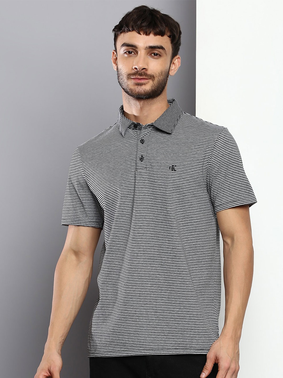 

Calvin Klein Jeans Men Striped Polo Collar Monochrome Pure Cotton T-shirt, Black