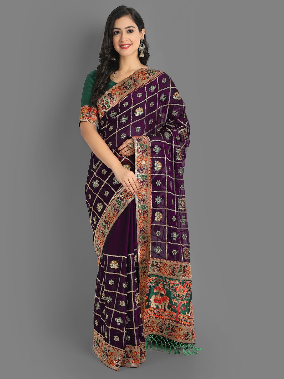 

Ekta Textiles Purple & Green Floral Embroidered Silk Blend Patola Saree