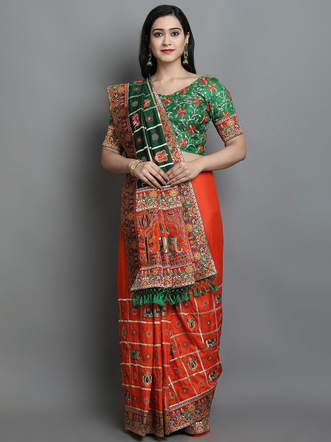 

Ekta Textiles Orange & Red Ethnic Motifs Embroidered Silk Blend Half and Half Patola Saree