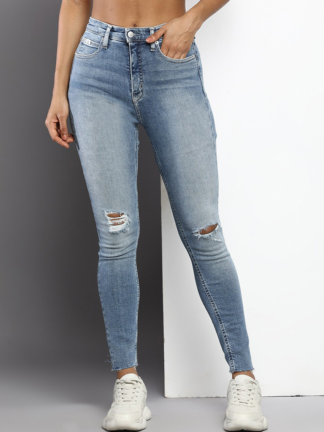 

Calvin Klein Jeans Women Super Skinny Fit High-Rise Mildly Distressed Stretchable Jeans, Blue