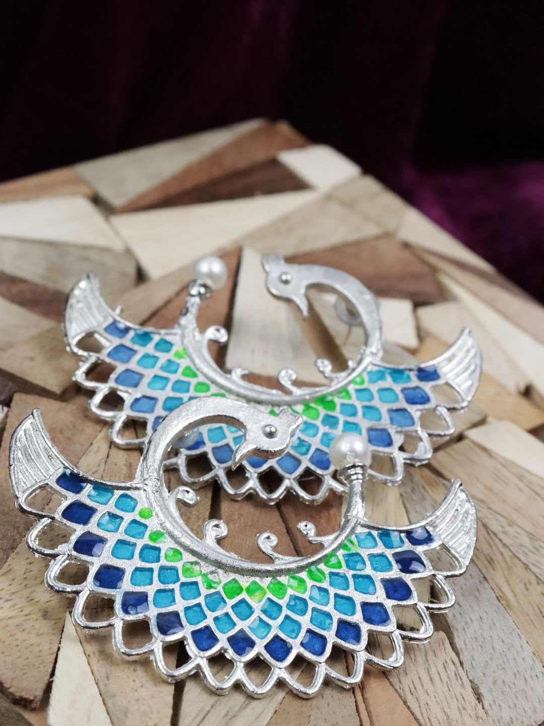 

VAGHBHATT Women Silver-Plated Peacock Shaped Stud Earrings, Blue