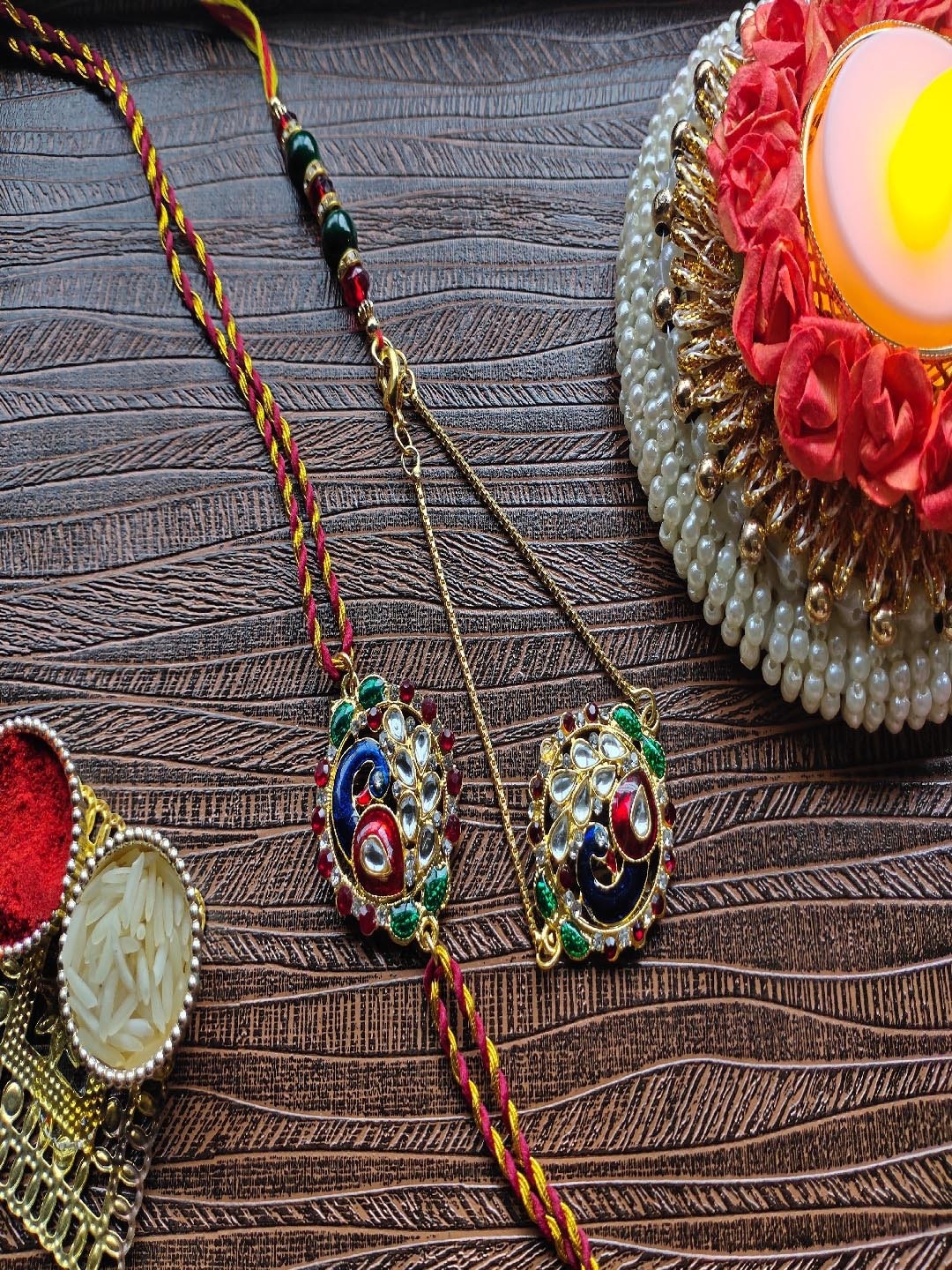 

Mahi Set of 2 Rakhi Peacock Shaped Meenakari Work Bhaiya Bhabhi Rakhi, Red