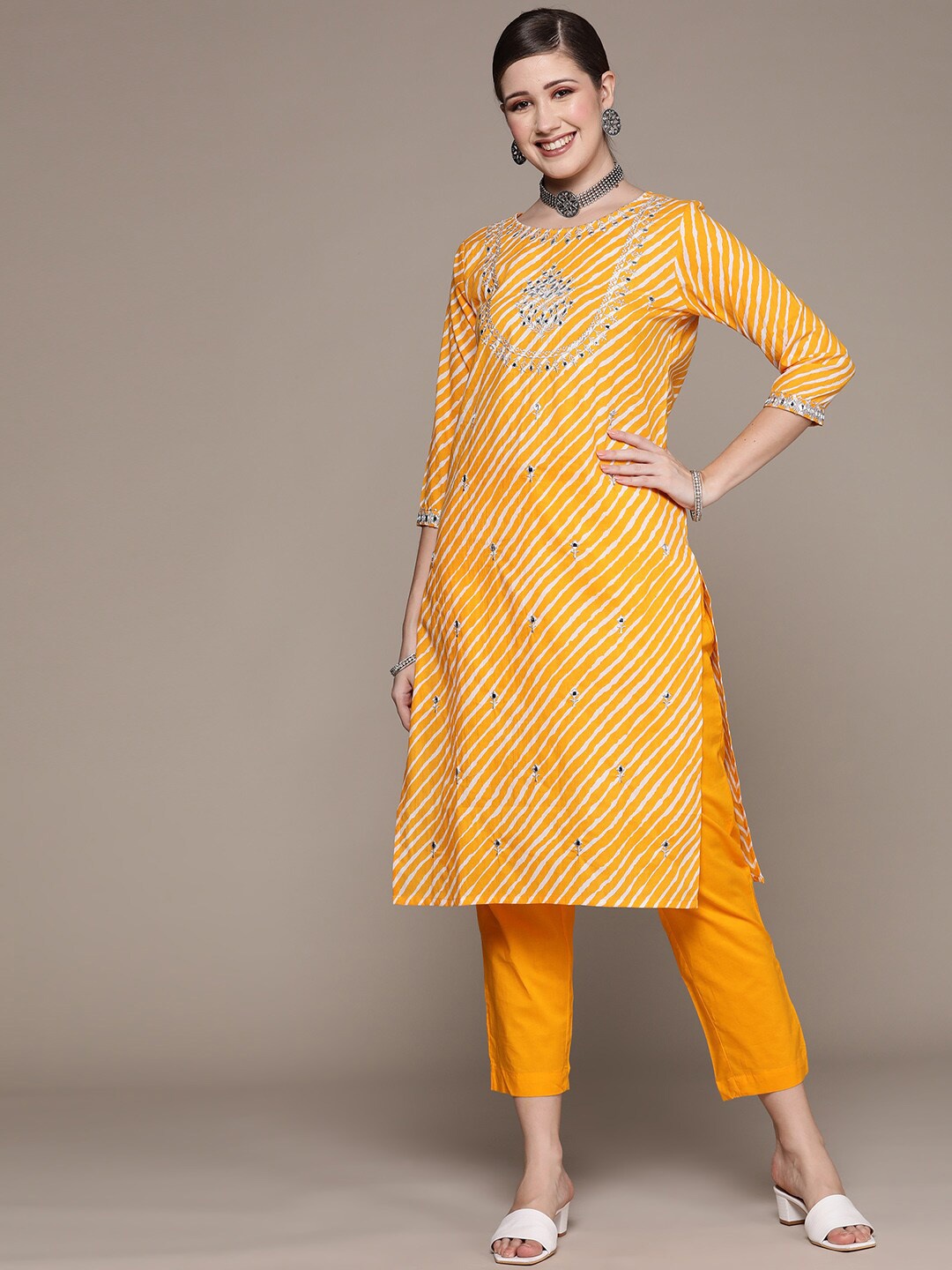 

Ishin Women Leheriya Printed Thread Work Pure Cotton Kurta with Trousers, Yellow