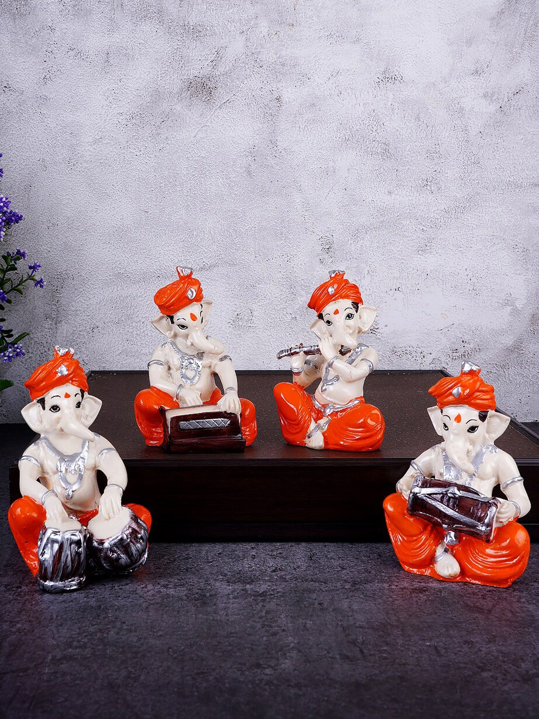 

FASHIYANOO Cream & Orange 4 Pcs Ganesh Ji With Musical Instruments Showpieces