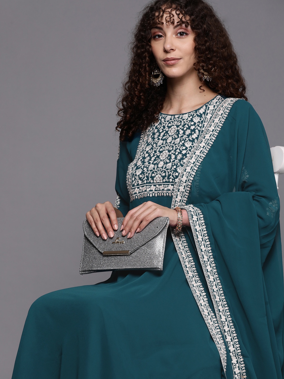 

Inddus Women Teal & White Floral Yoke Design Thread Work Georgette Kurta