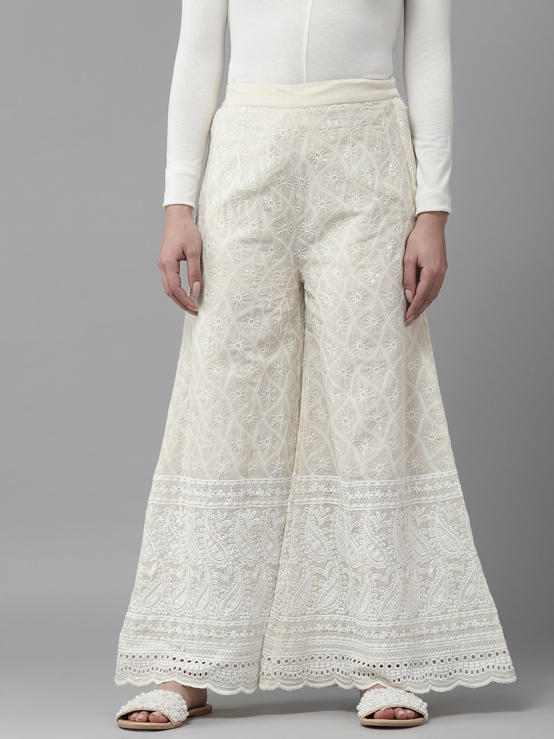 

Aarika Women Ethnic Motifs Embroidered Flared Chambray Cotton Ethnic Palazzos, White