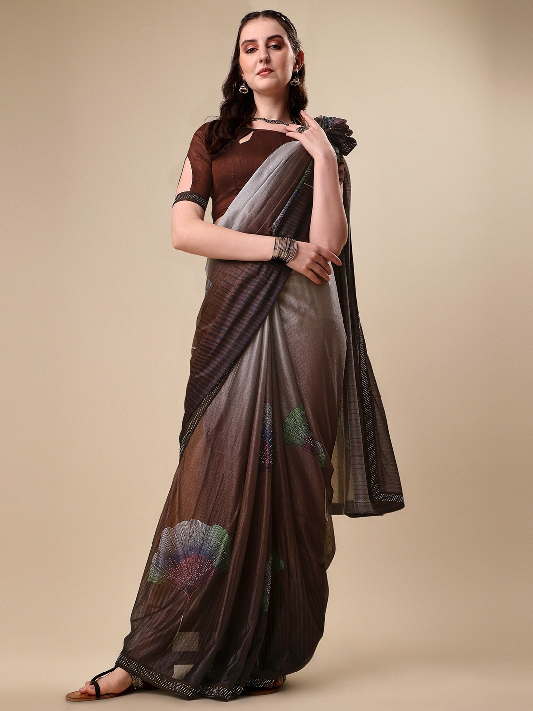 

Vaidehi Fashion Brown & Grey Floral Beads and Stones Silk Blend Saree