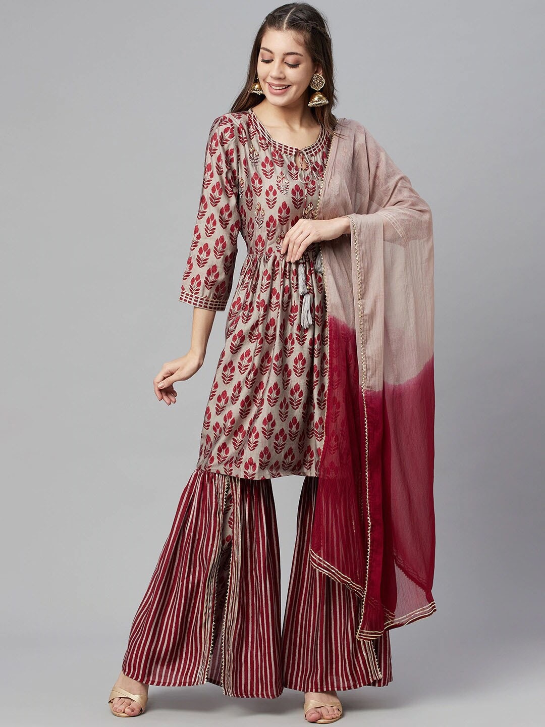 

Readiprint Fashions Women Floral Printed Kurta with Sharara & With Dupatta, Maroon