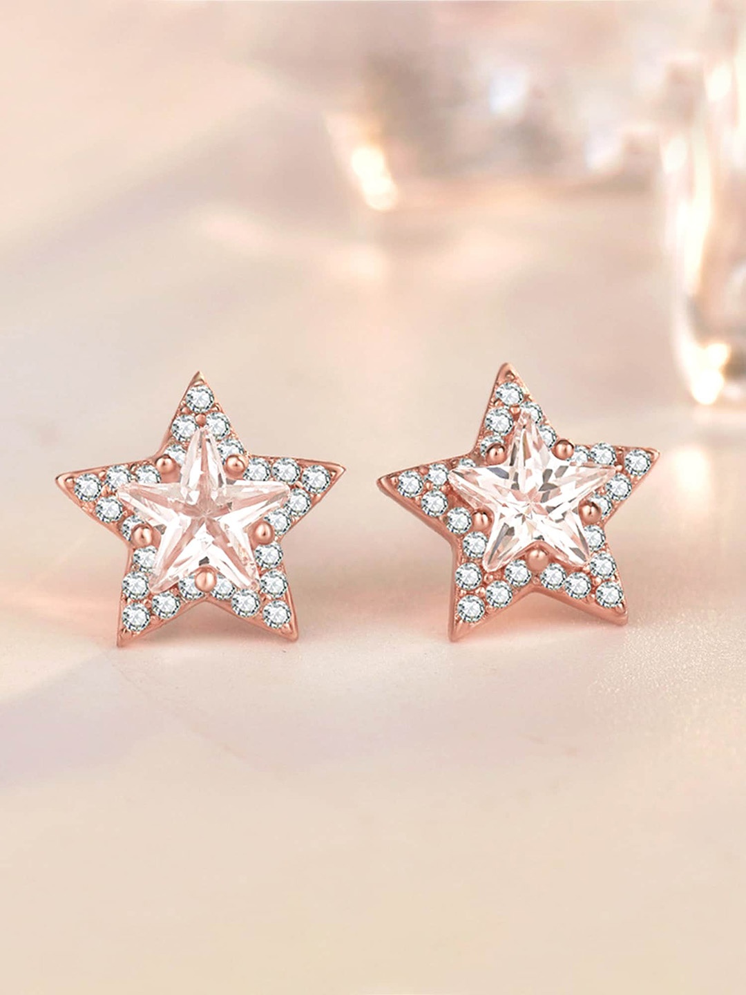 

Raajsi by Yellow Chimes Rose Gold Plated Star Shaped Studs Earrings, White