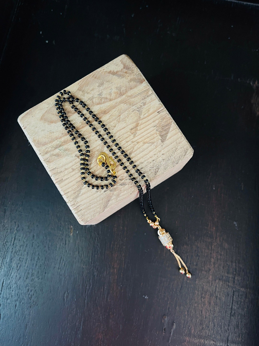 

The Opal Factory Gold-Plated Beaded & AD Studded Mangalsutra, Black