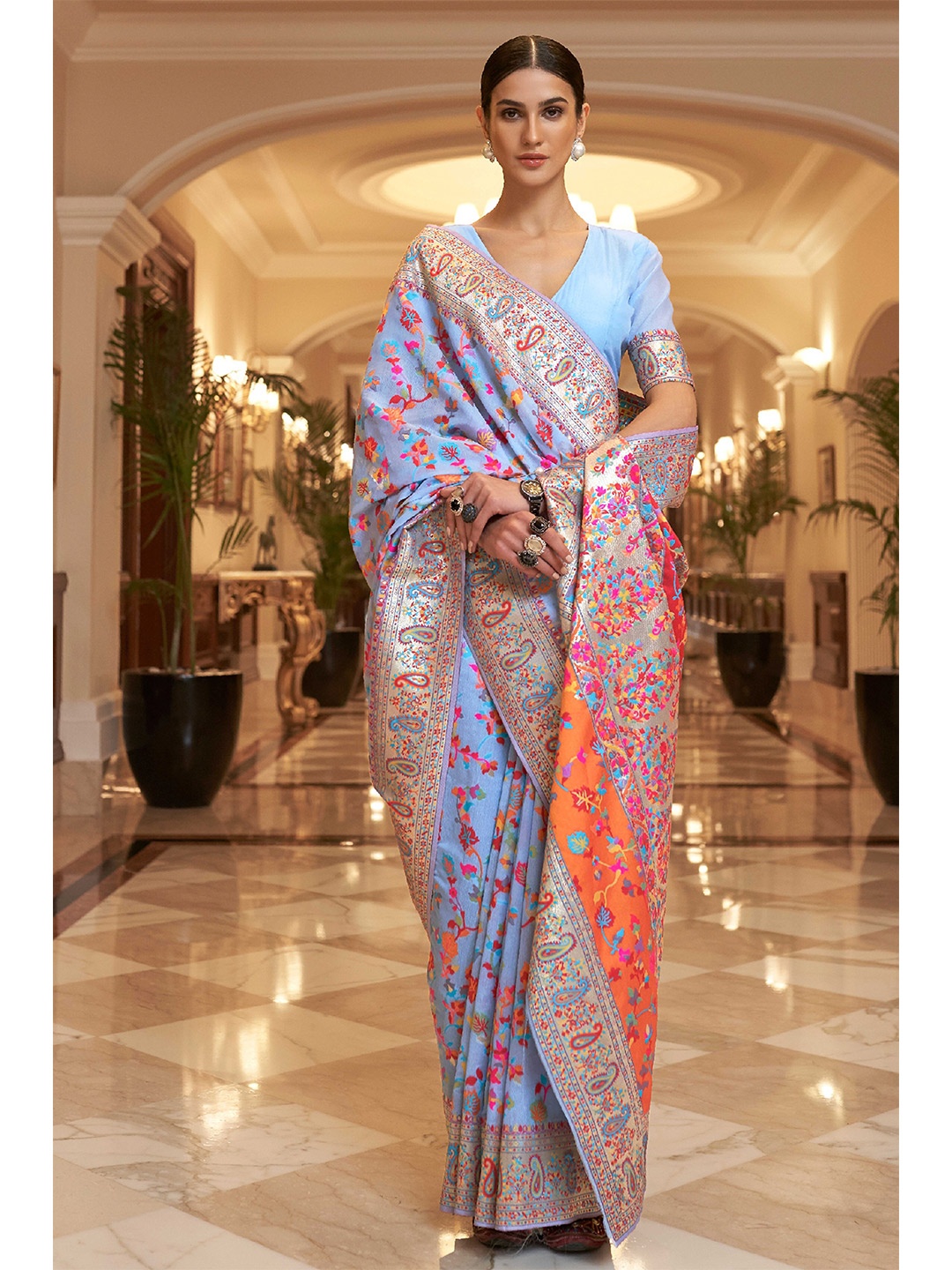 

Ekta Textiles Lavender & Red Floral Zari Banarasi Saree