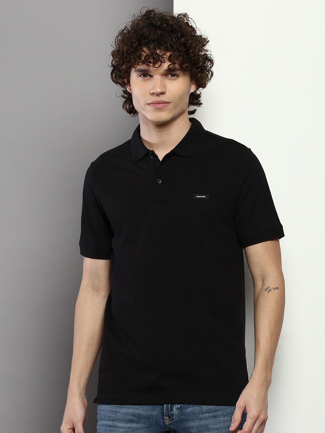 

Calvin Klein Jeans Men Pique Knit Polo Slim Fit T-shirt, Black