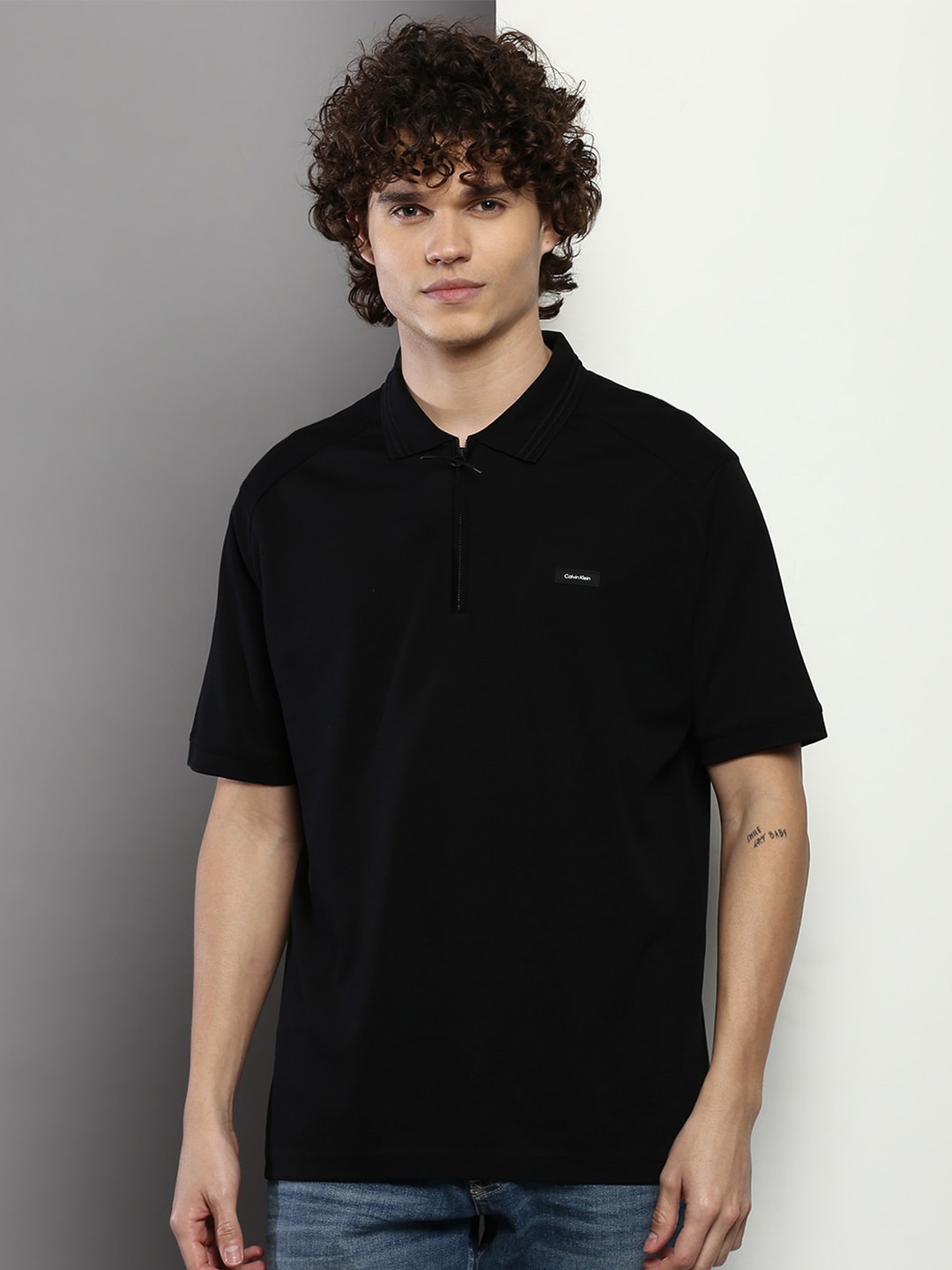 

Calvin Klein Jeans Men Polo Collar Pure Cotton T-shirt, Black