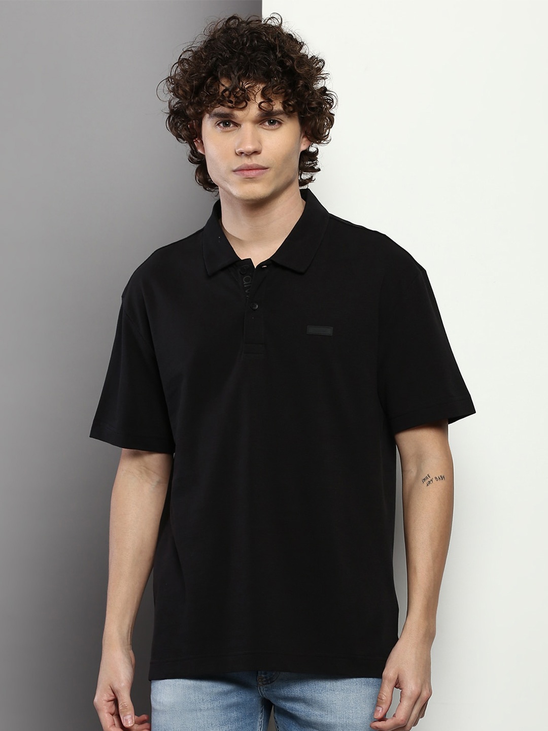 

Calvin Klein Jeans Men Polo Collar Cotton T-shirt, Black