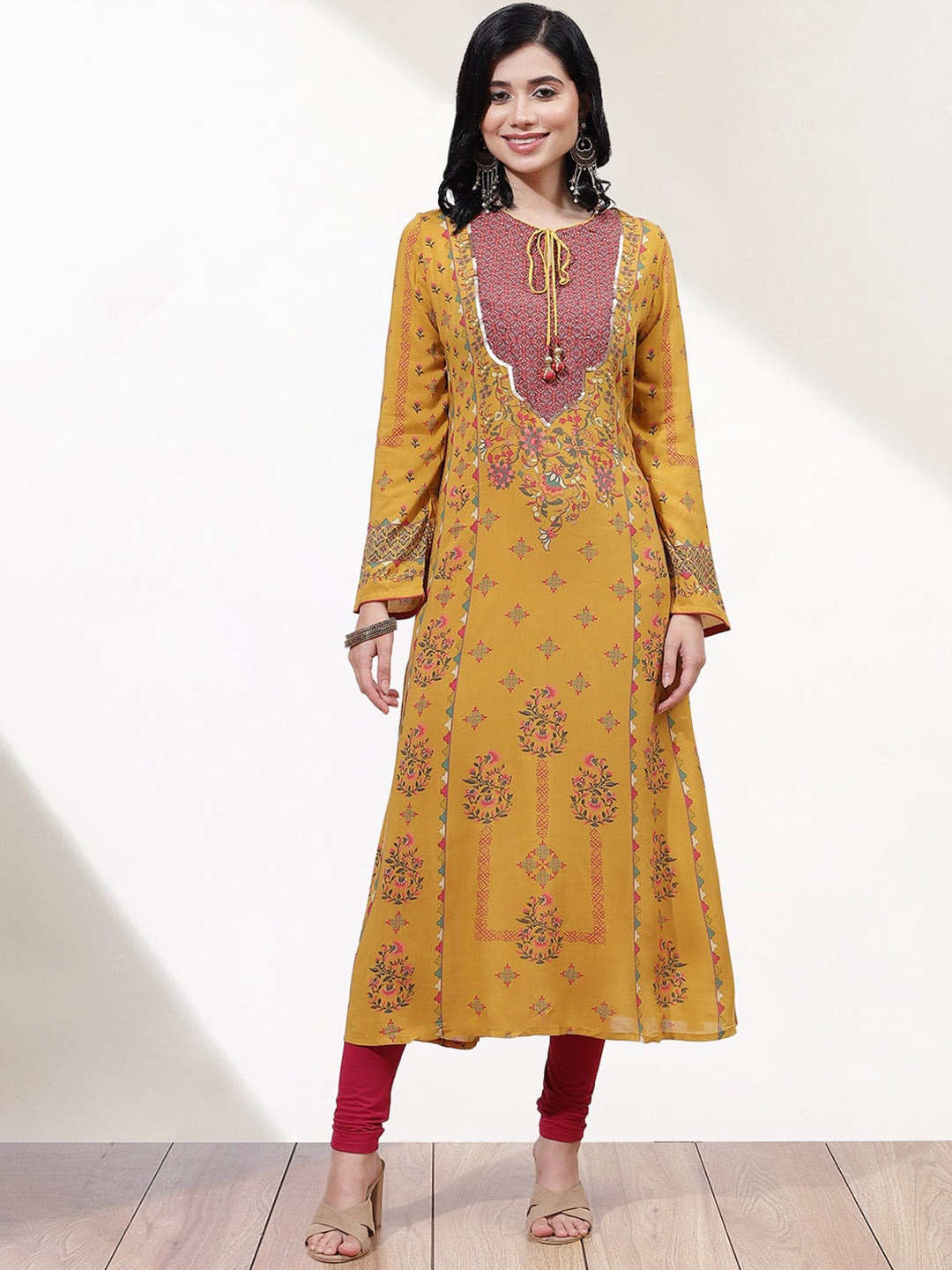 

Lakshita Women Plus Size Ethinc Motifs Printed Tie-Up Neck A-Line Kurta, Mustard