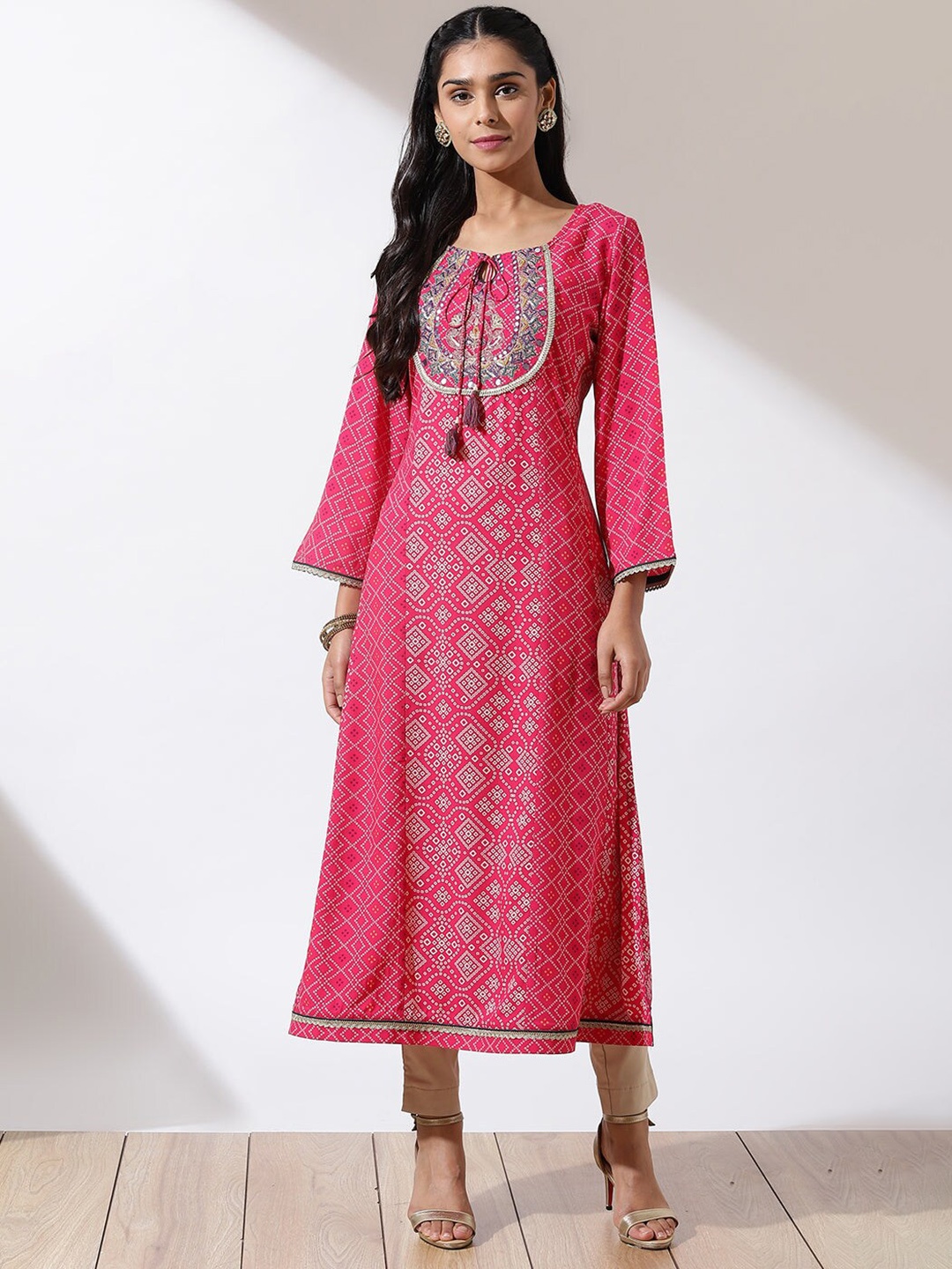 

Lakshita Women Plus Size Bandhani Printed Tie-Up Neck Flared Sleeves Mirror Work Kurta, Fuchsia