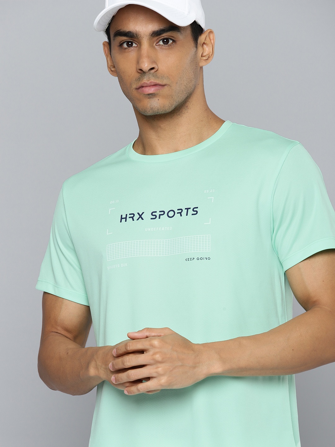 

HRX by Hrithik Roshan Men Badminton Solid T-shirt, Green