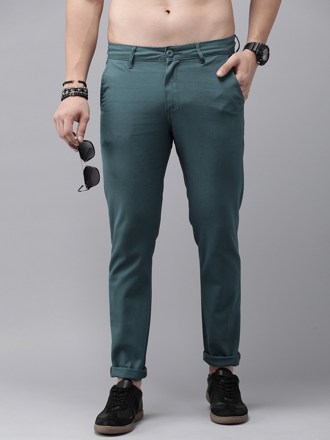 

The Roadster Lifestyle Co. Men Solid Mid-Rise Regular Fit Trousers, Teal