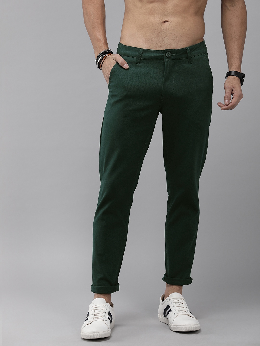 

The Roadster Lifestyle Co. Men Solid Mid Rise Flat Front Trousers, Green