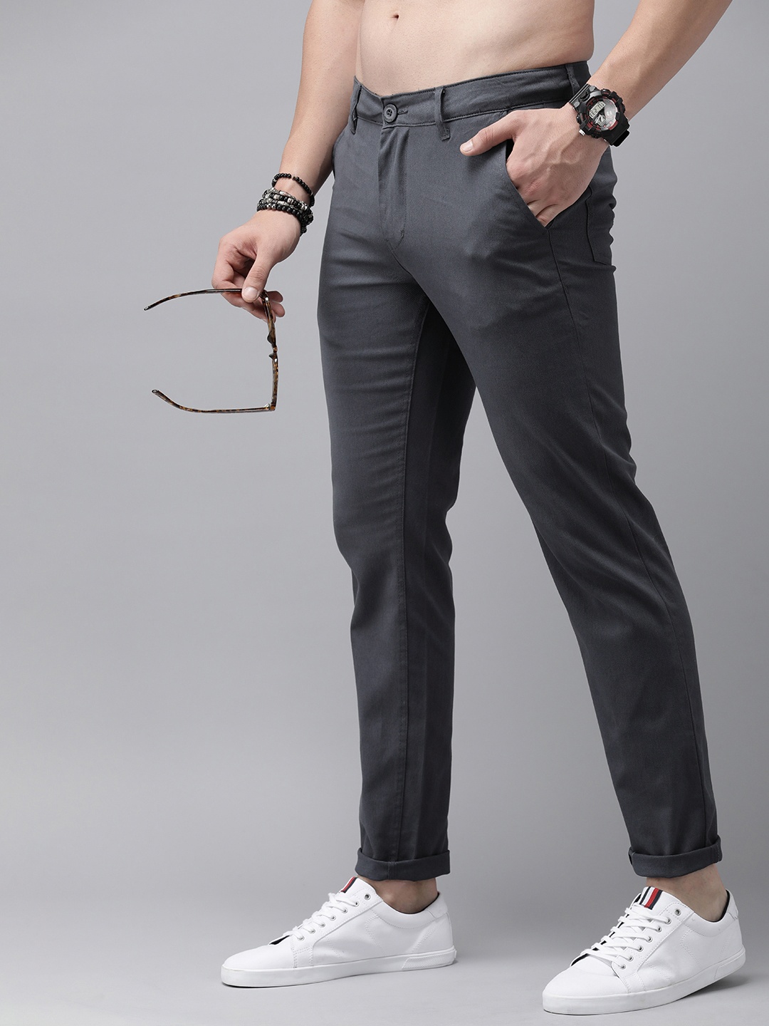 

The Roadster Lifestyle Co. Men Solid Mid-Rise Regular Fit Trousers, Grey