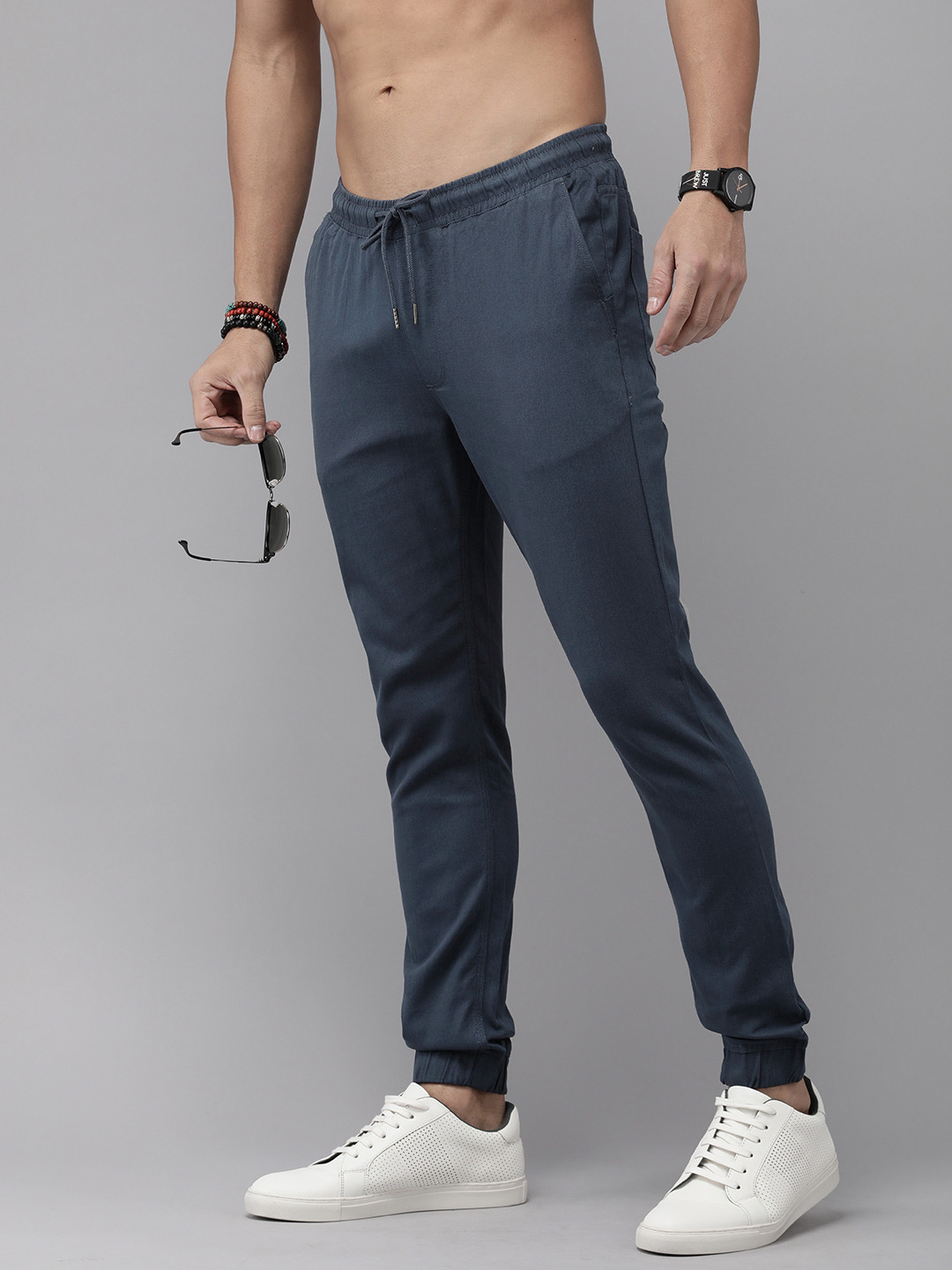 

The Roadster Life Co. Men Solid Mid-Rise Regular Joggers, Blue