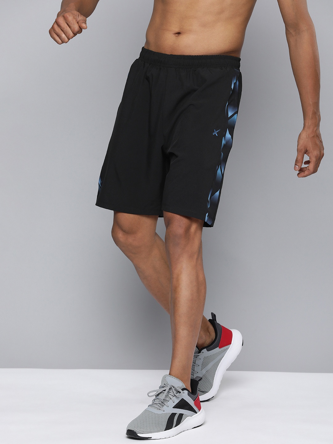 

HRX by Hrithik Roshan Men Solid Rapid-Dry Sports Shorts With Side Prints, Black