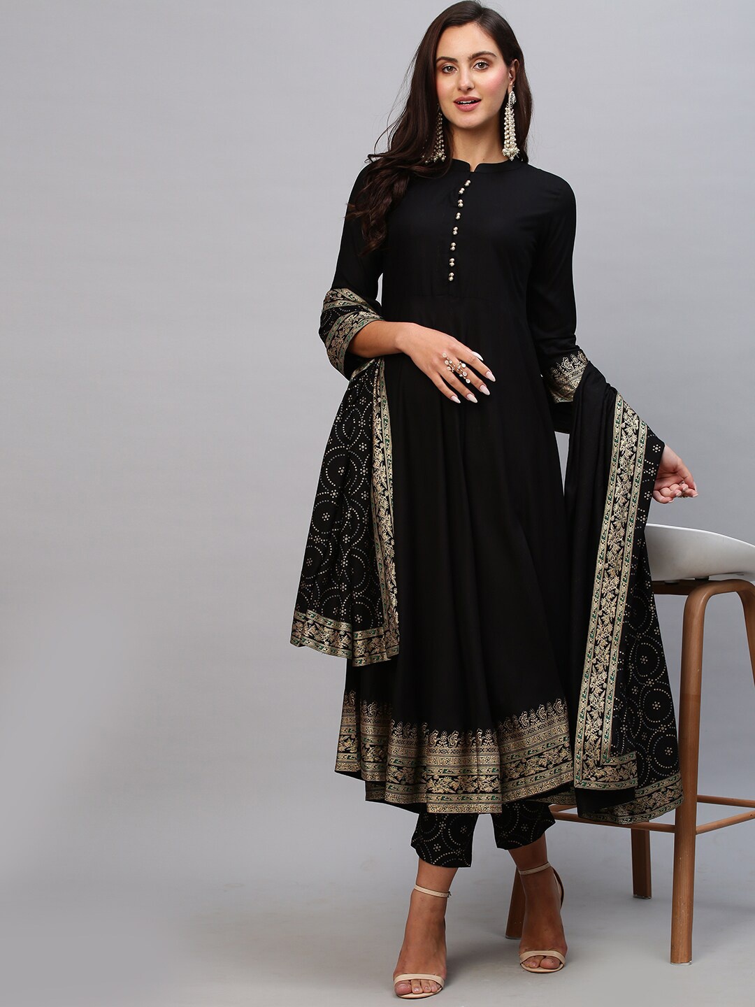 

GoSriKi Women Black Solid Anarkali Kurta with Trousers & With Dupatta