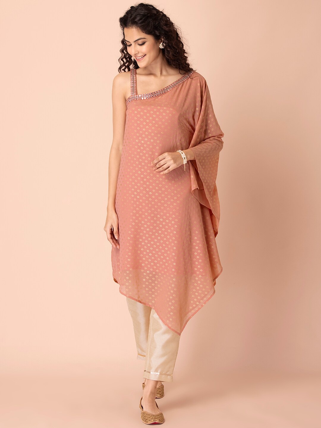 

Rang by Indya Women Foil Printed One Shoulder Mirror Work Asymmetric Kaftan Kurta, Peach