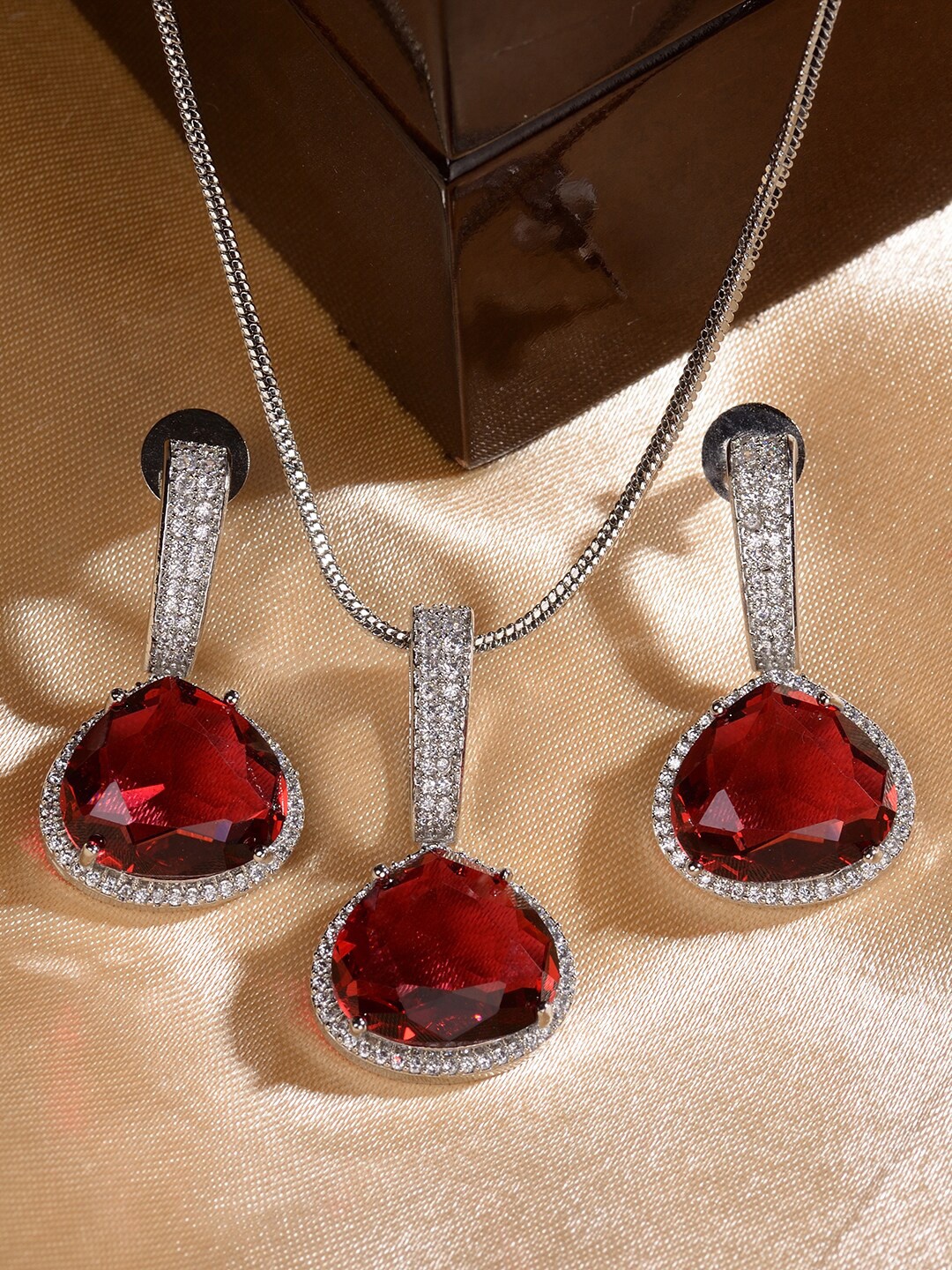 

Saraf RS Jewellery Women Silver-Plated AD Stone-Studded Pendant and Earrings, Maroon