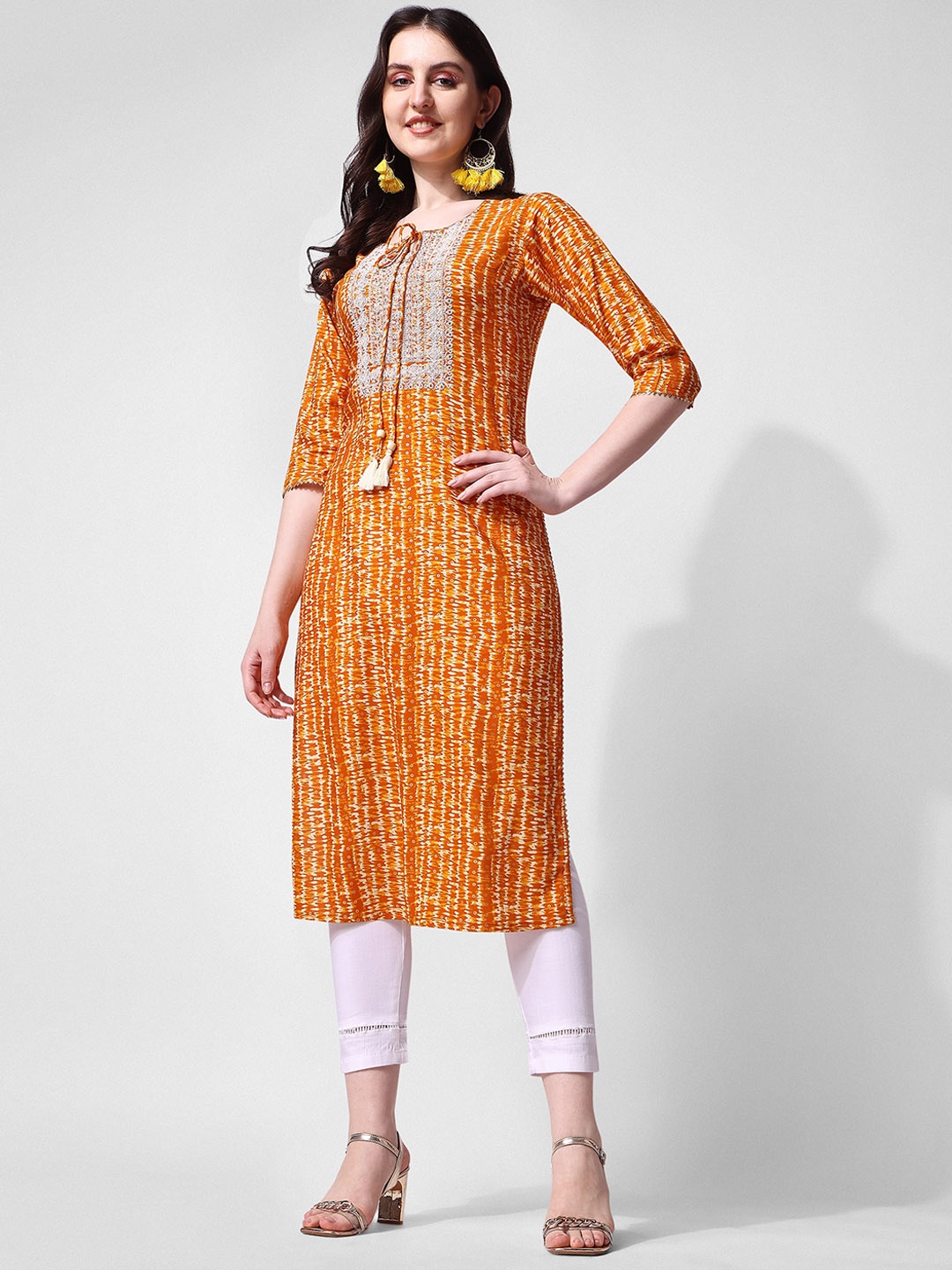 

Berrylicious Women Abstract Printed Thread Work Tie-Up Neck Kurta, Mustard