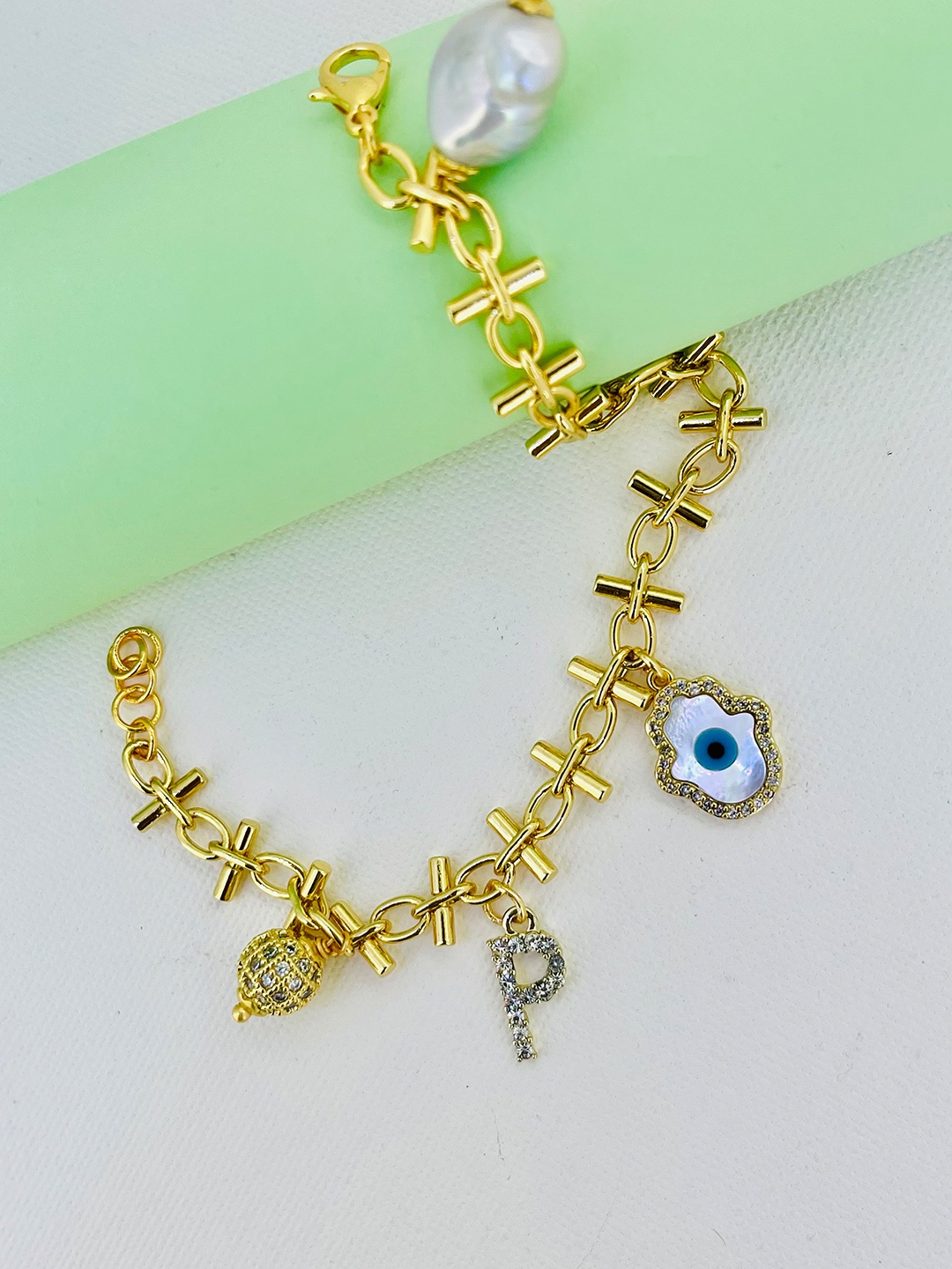 

CURIO COTTAGE Women Gold-Plated Stone Studded Evil Eye Charm Bracelet, White