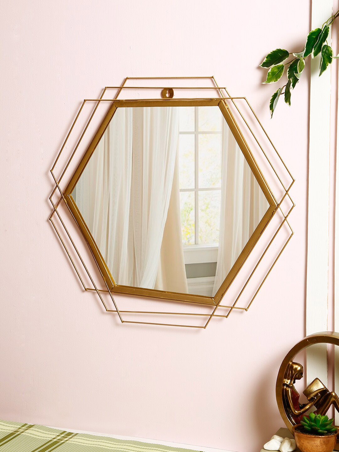 

Aapno Rajasthan Gold-Toned Pentagon Design Metallic Framed Mirror