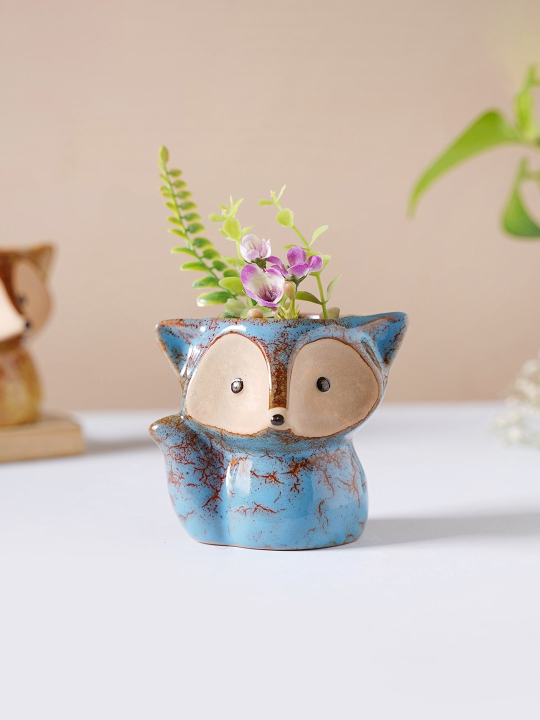 

Nestasia Blue & Brown Printed Ceramic Fox Shaped Planter