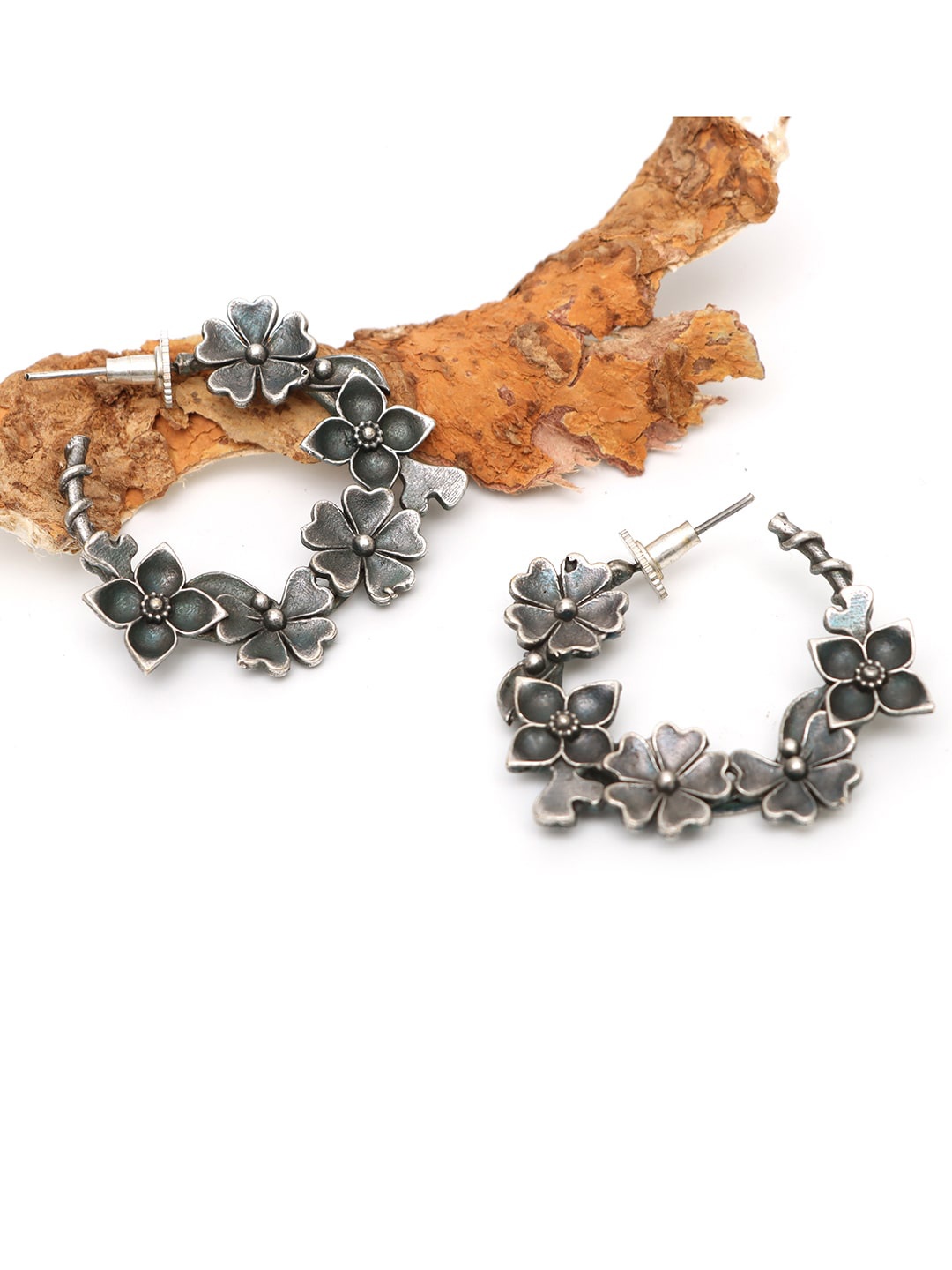 

Ozanoo Brass Plated Floral Stone Studded Half Hoop Earrings, Silver