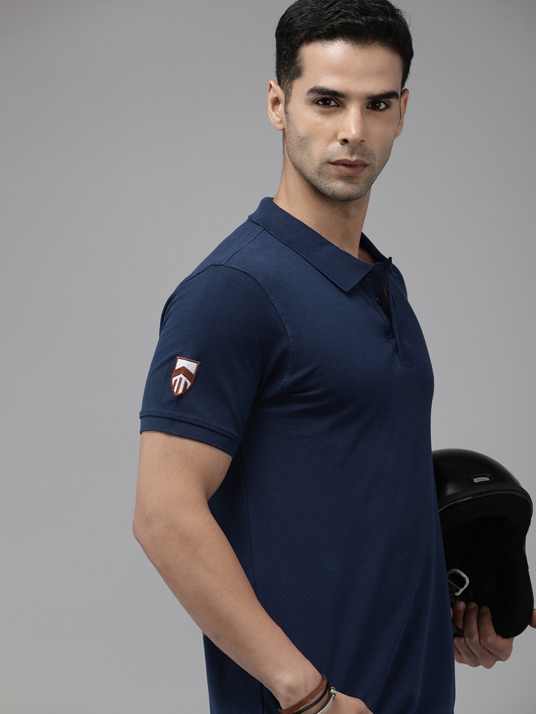 

The Roadster Lifestyle Co. Men Solid Polo Collar Pure Cotton Applique T-shirt, Navy blue