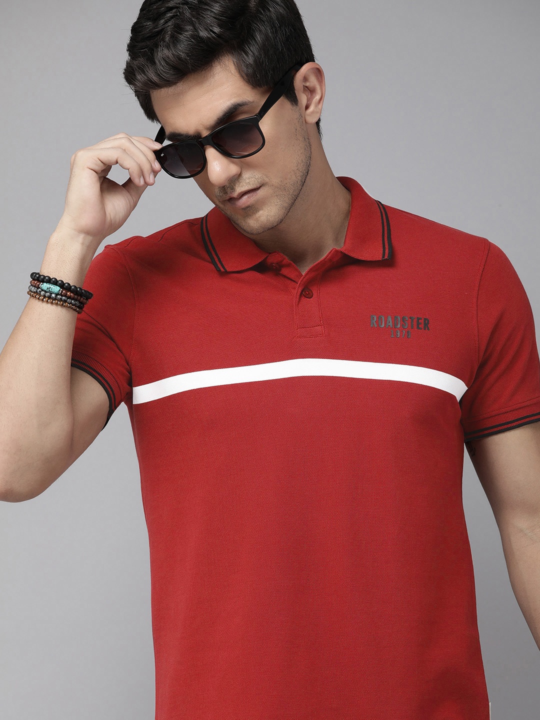 

The Roadster Lifestyle Co. Men Striped Polo Collar Pure Cotton T-shirt, Red