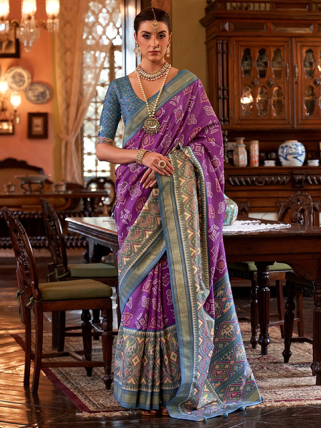 

Anouk Ethnic Motifs Woven Design Zari Silk Blend Ikat Saree, Purple