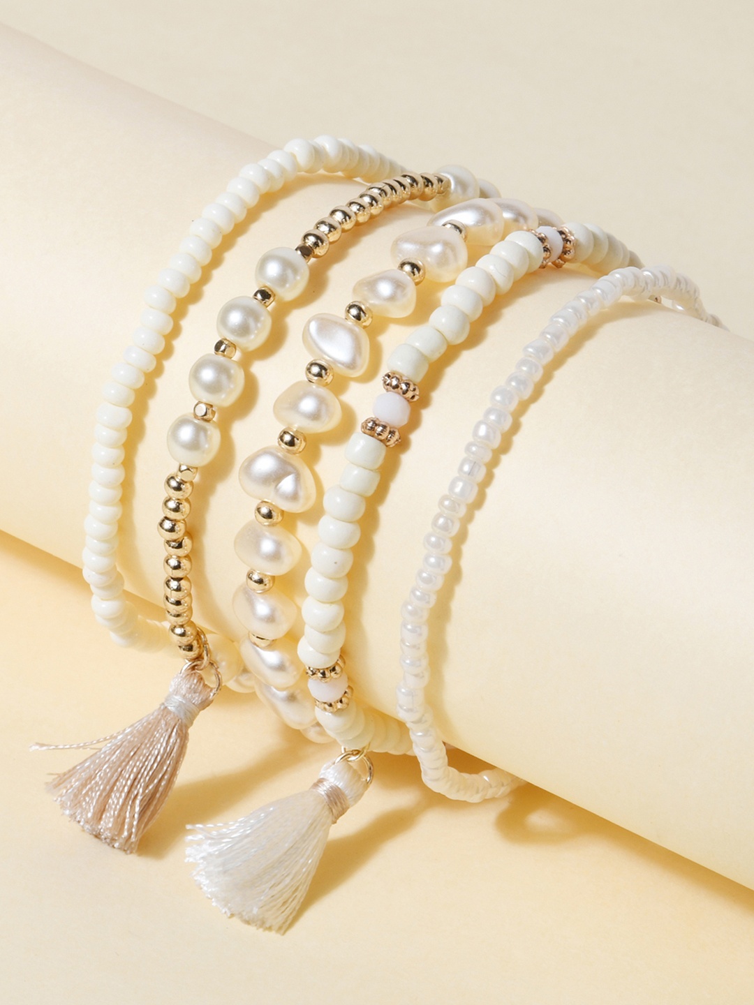 

ToniQ Women Set of 5 Elasticized Tasselled Gold-Plated Bracelet