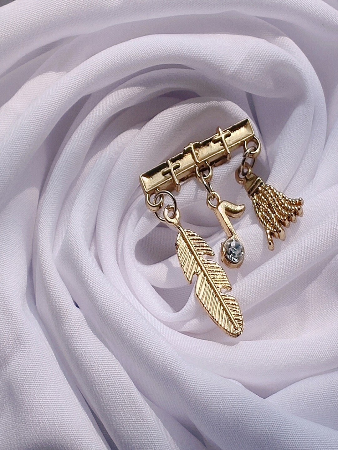 

Mahi Men Stone-Studded Hanging Feather Musical Note and Broom Brooch, Gold
