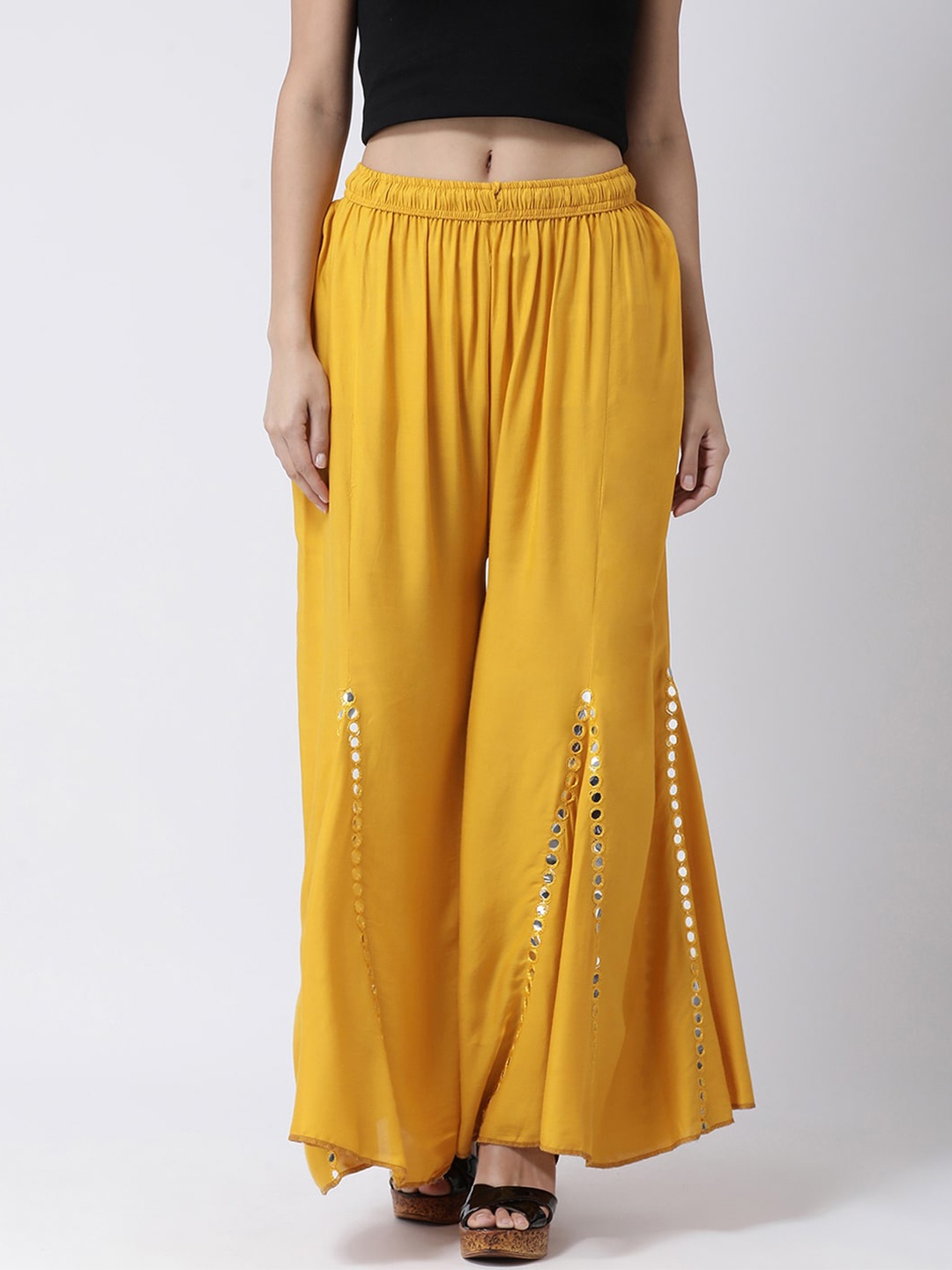 

Charitra Women Embellished Flared Ethnic Palazzos, Mustard