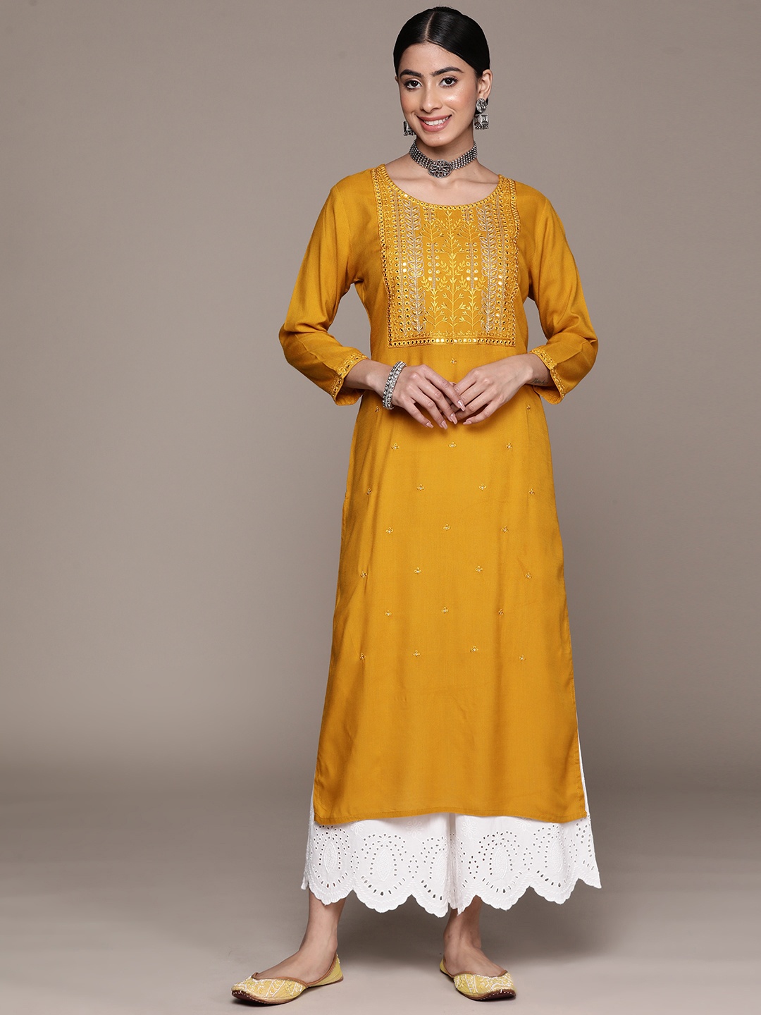

Ishin Women Floral Yoke Design Mirror Work Kurta, Mustard
