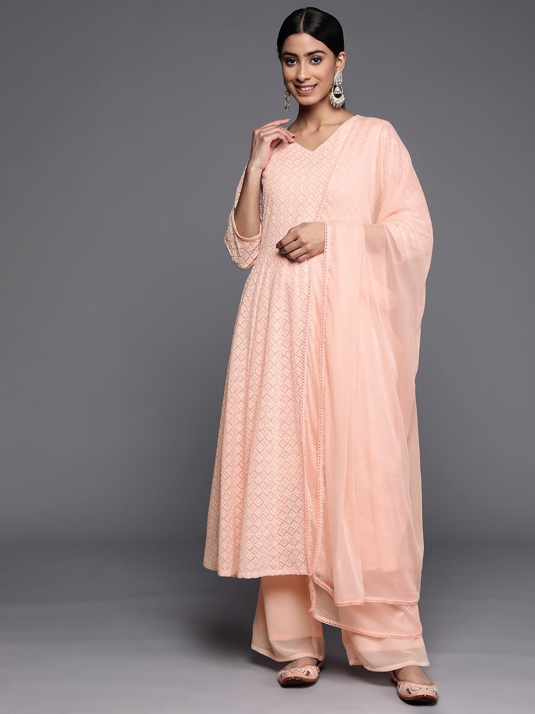 

Inddus Women Peach-Coloured Embroidered Chikankari Kurta with Palazzos & With Dupatta