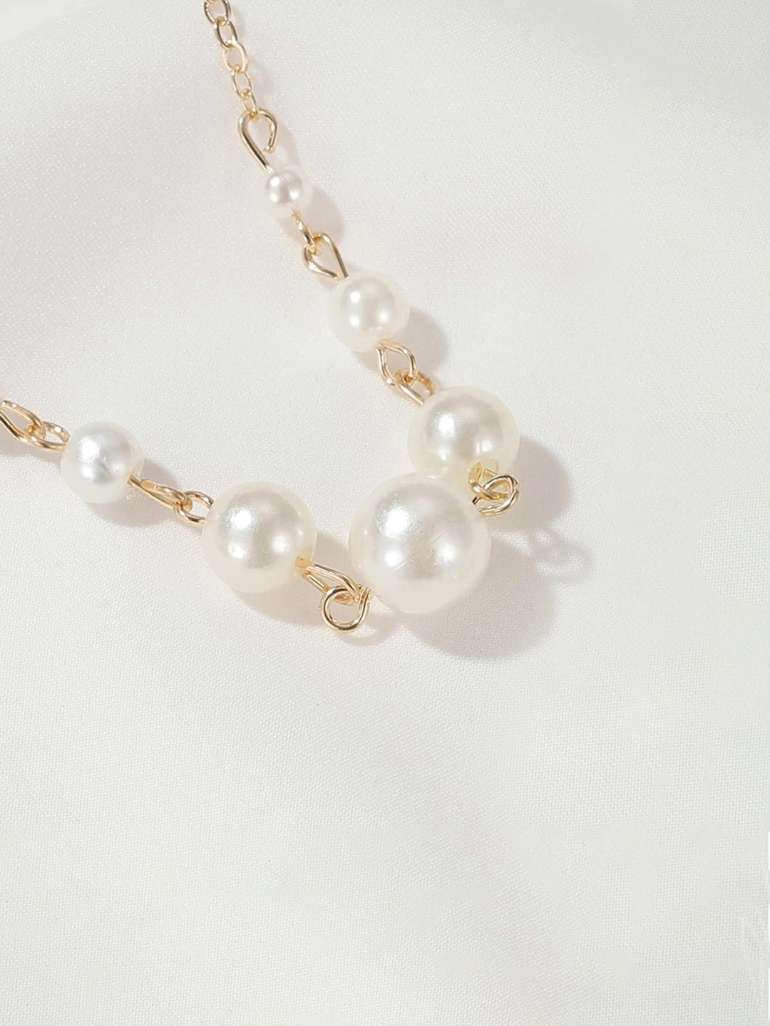 

Jewels Galaxy Brass Pearl Studded Gold-Plated Statement Necklace