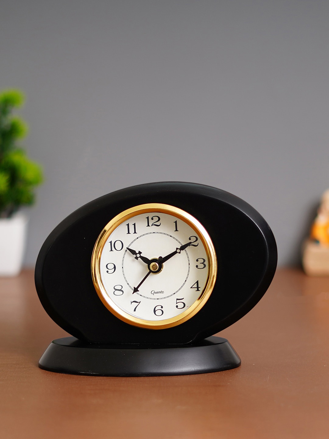 

eCraftIndia Black & White Oval Analogue Striking Movement Traditional Table Clock