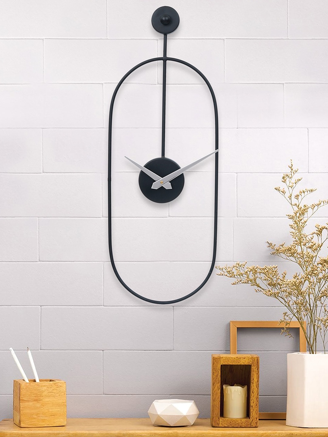 

eCraftIndia Black & Silver-Toned Oval Analogue Contemporary Wall Clock