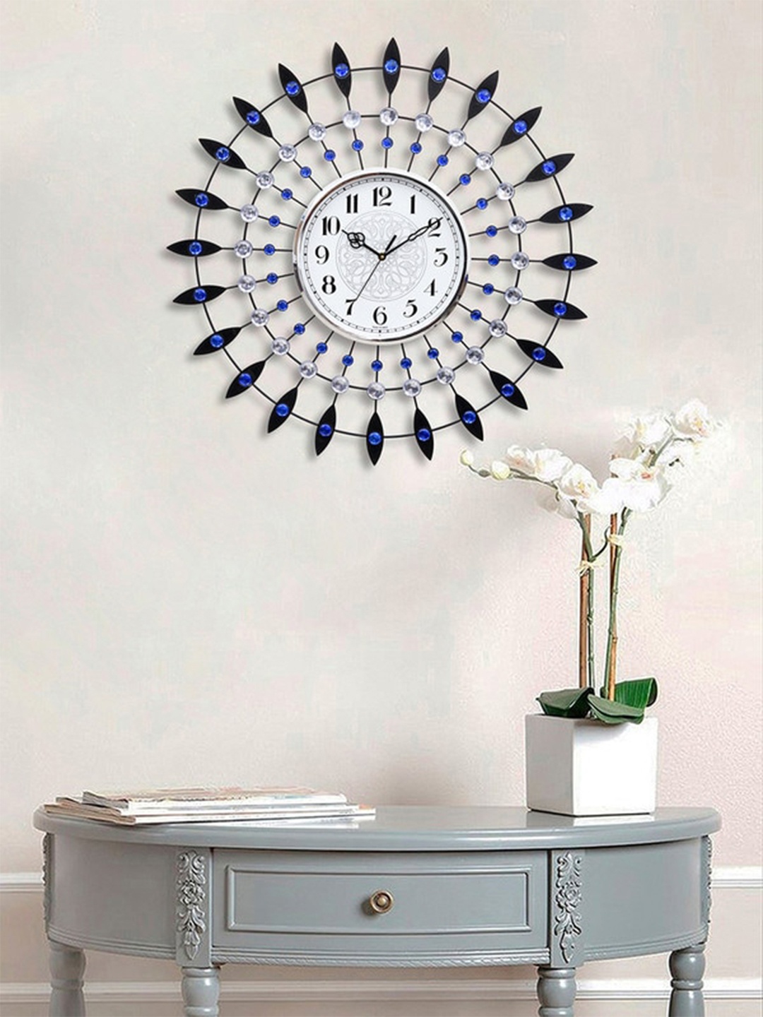 

eCraftIndia Blue & Silver-Toned Embellished Analogue Floral Contemporary Wall Clock