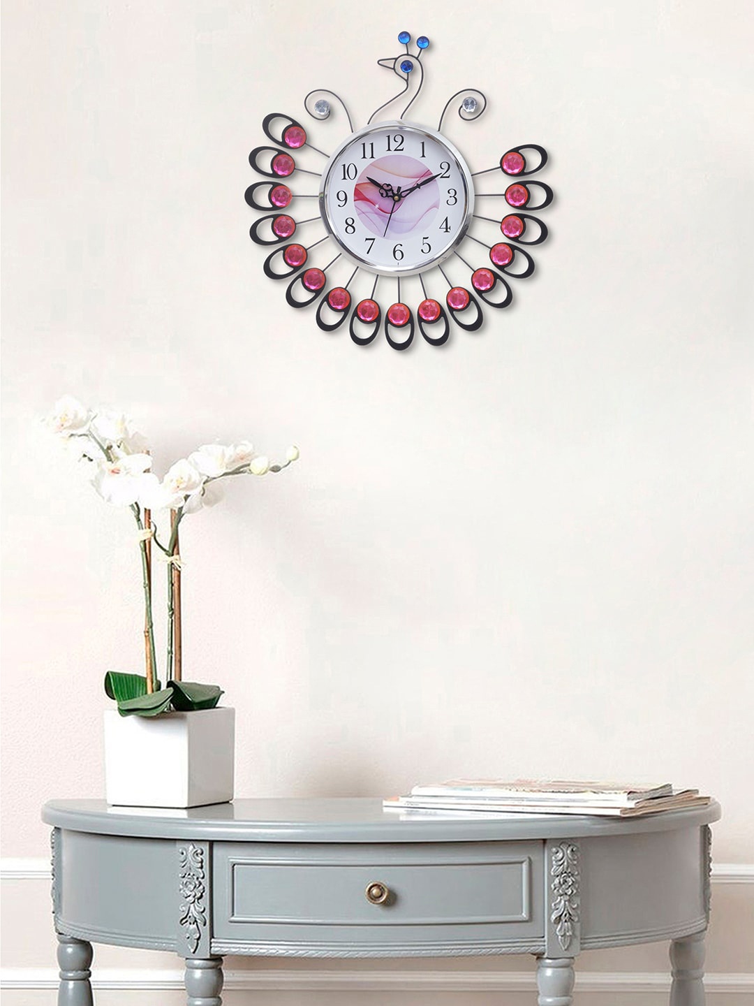 

eCraftIndia Pink & Silver-Toned Embellished Abstract Shaped Contemporary Wall Clock