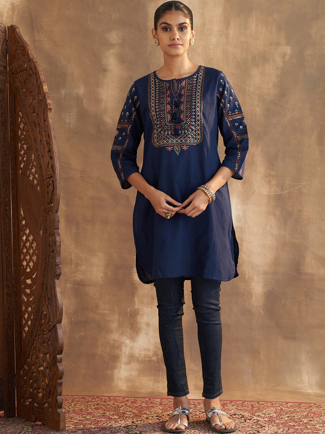 

Lakshita Plus Size Ethnic Motifs Embroidered Sequinned Tie Up Neck Pure Cotton Kurti, Navy blue