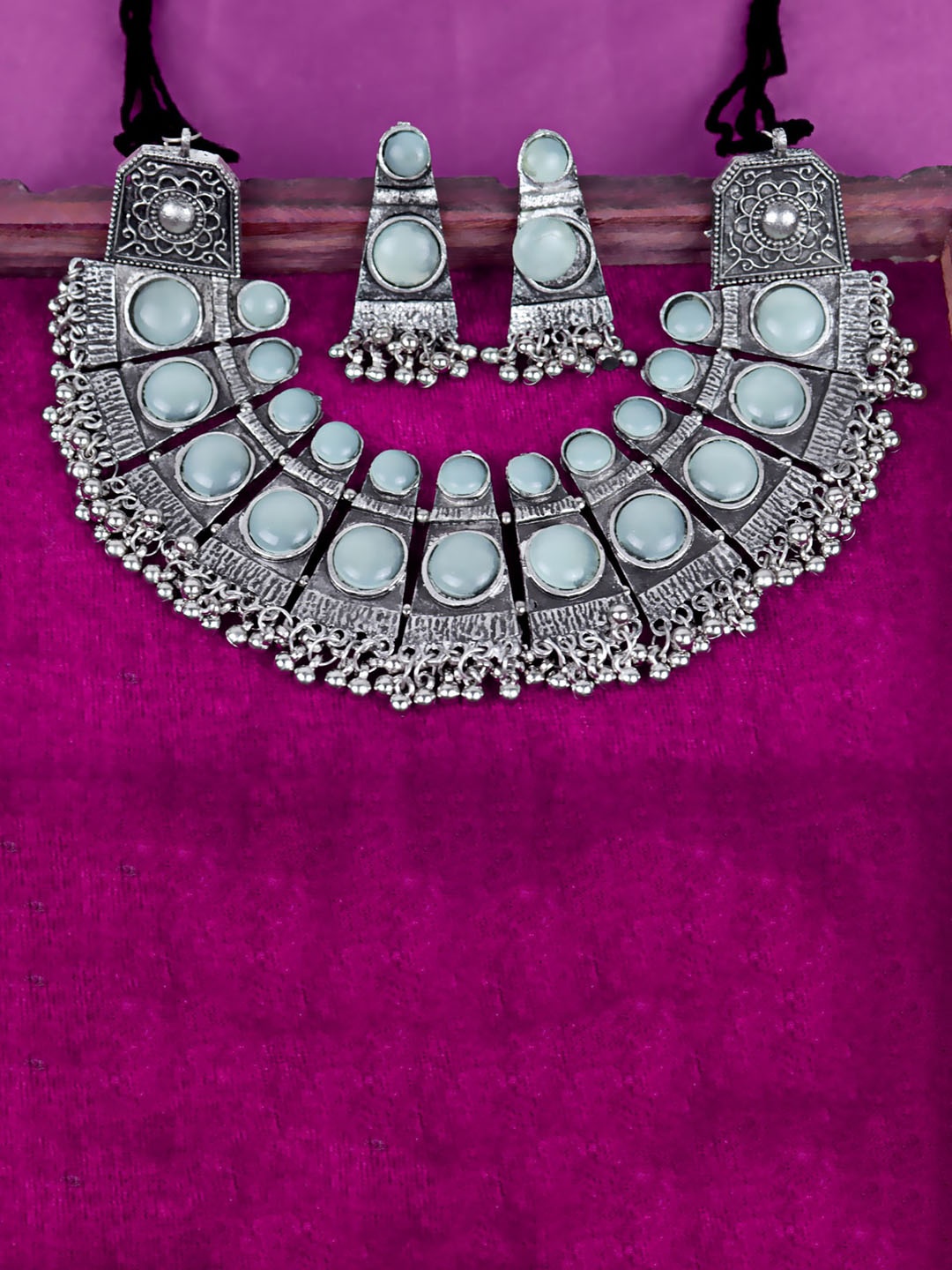 

VAGHBHATT Silver-Plated Oxidised Stone Studded Ghunghroo Choker & Earing Jewellery Set, Sea green